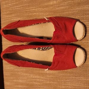 Size 5.5 red Toms wedges. Never worn!